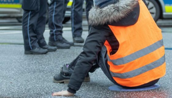 A,Climate,Activist,Stuck,Herself,To,The,Asphalt,In,Hamburg Sitzblockade